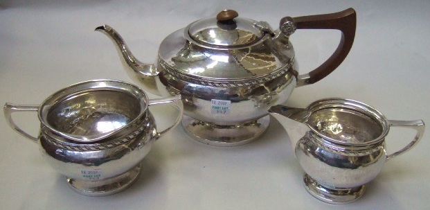 Appraisal: A silver three piece tea set comprising a teapot a