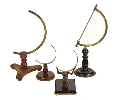 Appraisal: Four table globe stands three with turned stems with brass