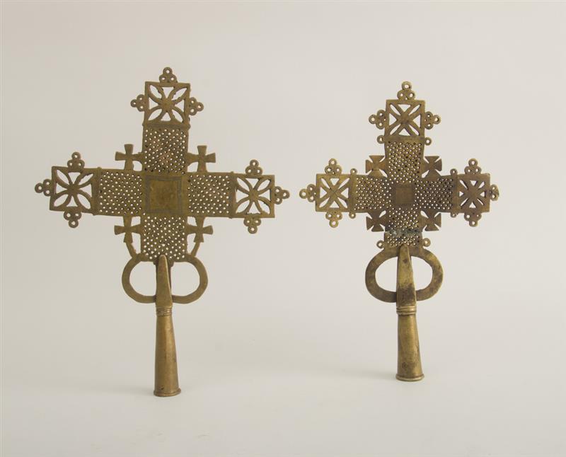 Appraisal: TWO ETHIOPIAN COPTIC GILT-METAL CROSS STANDARDS Each pierced with woven