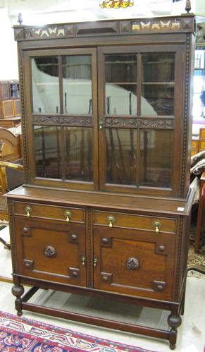 Appraisal: JACOBEAN STYLE OAK CHINA CABINET ON BUFFET English c The