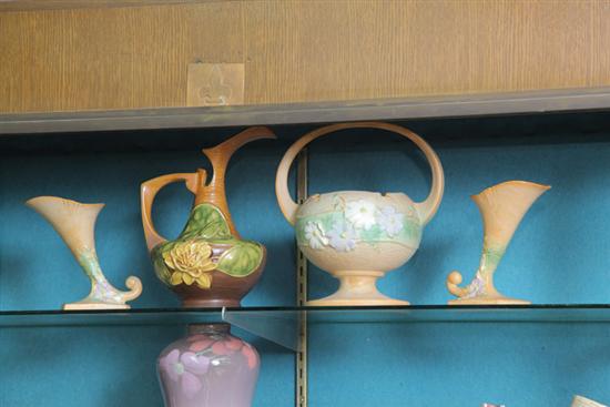 Appraisal: FOUR PIECES OF ROSEVILLE POTTERY A handled planter in Cosmos