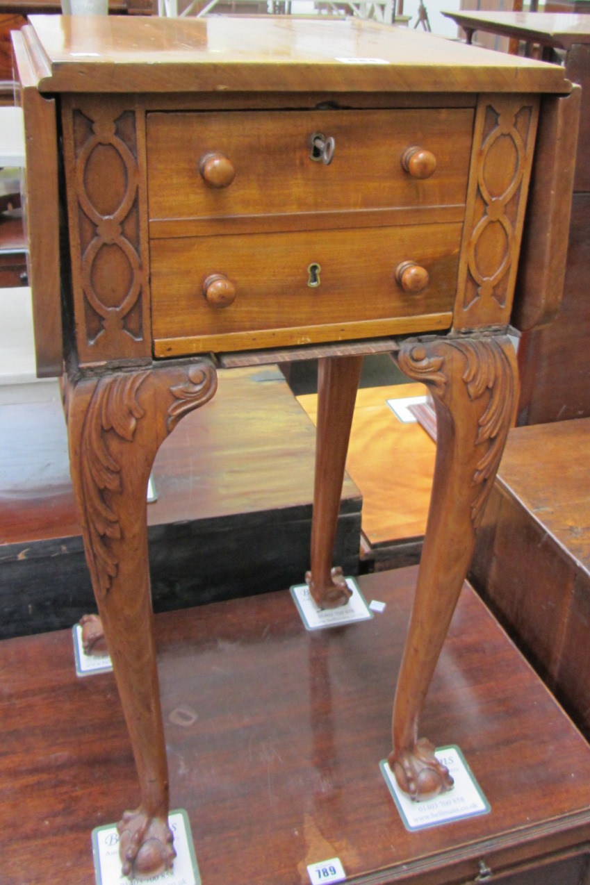 Appraisal: A th century mahogany drop flap work table on ball