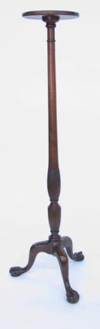 Appraisal: A tall carved mahogany plant stand with ball and talon