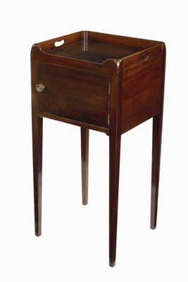 Appraisal: A late George III mahogany pot cupboard with pierced handgrips