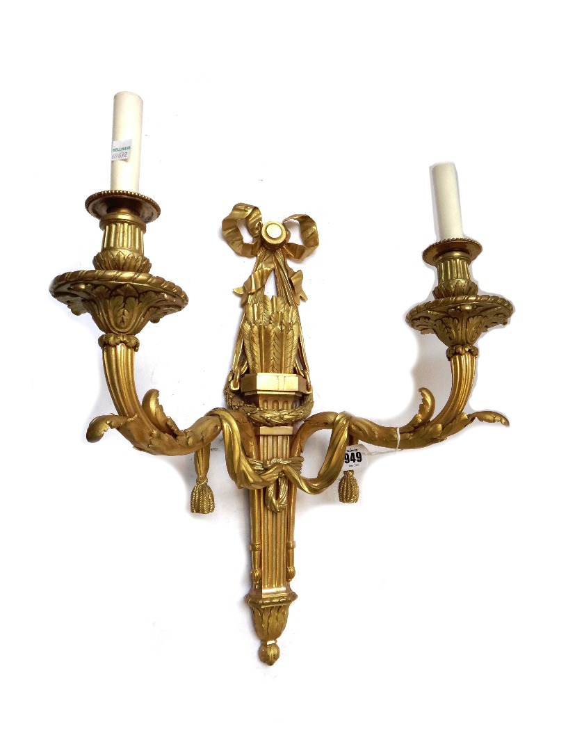 Appraisal: A pair of French ormolu twin branch wall lights th