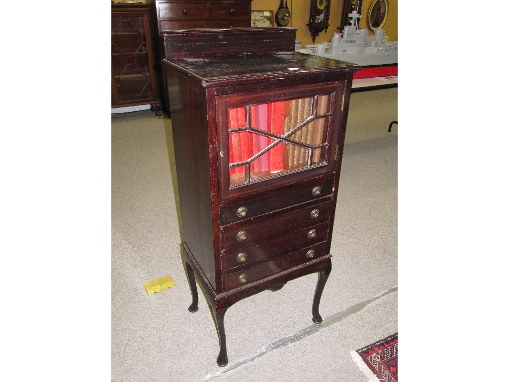 Appraisal: Mahogany music cabinet with a quantity of music books