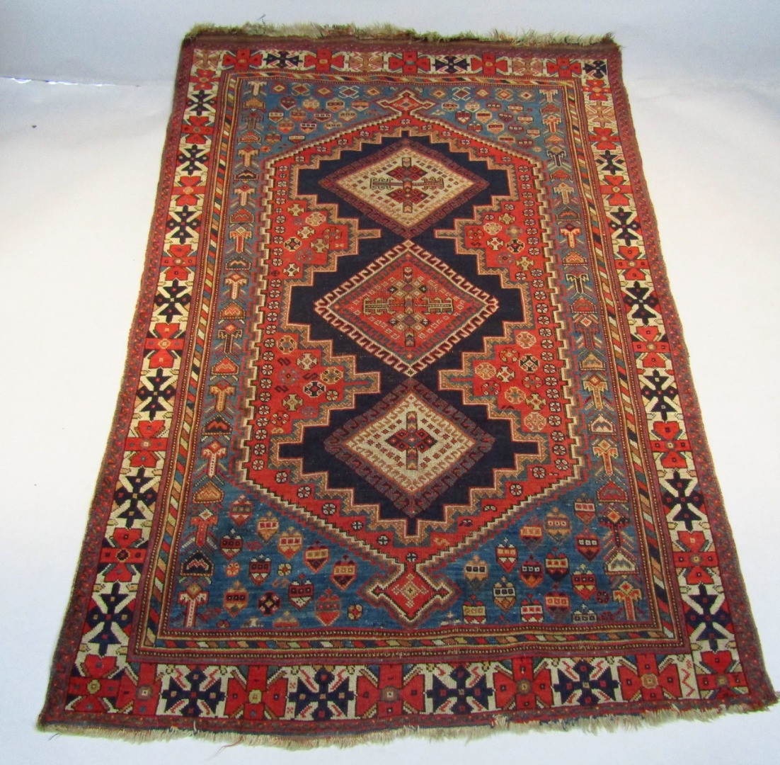 Appraisal: An early thC hearth rug in geometric pattern predominately in