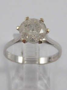 Appraisal: A white metal tests ct gold diamond solitaire ring marked