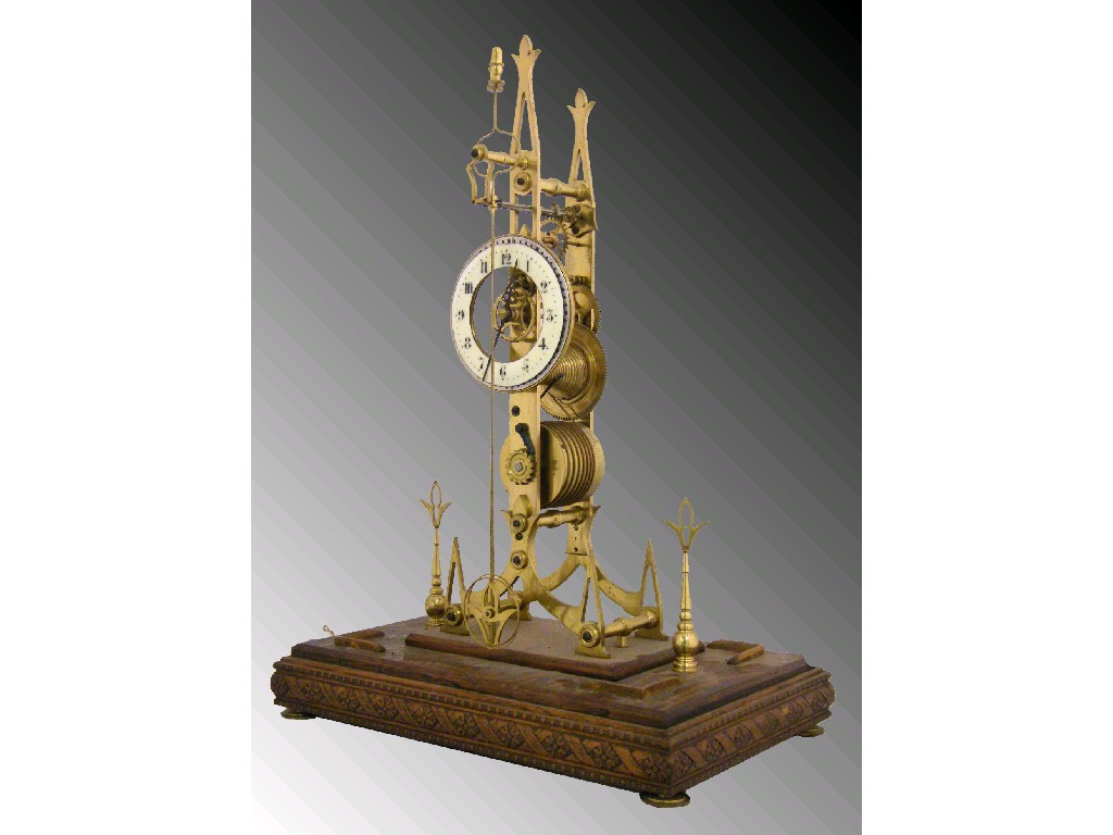 Appraisal: Unusual and rare single fusee brass skeleton clock with twin