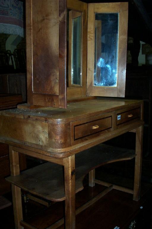 Appraisal: A Cotswold school walnut dressing table a triple mirror supported