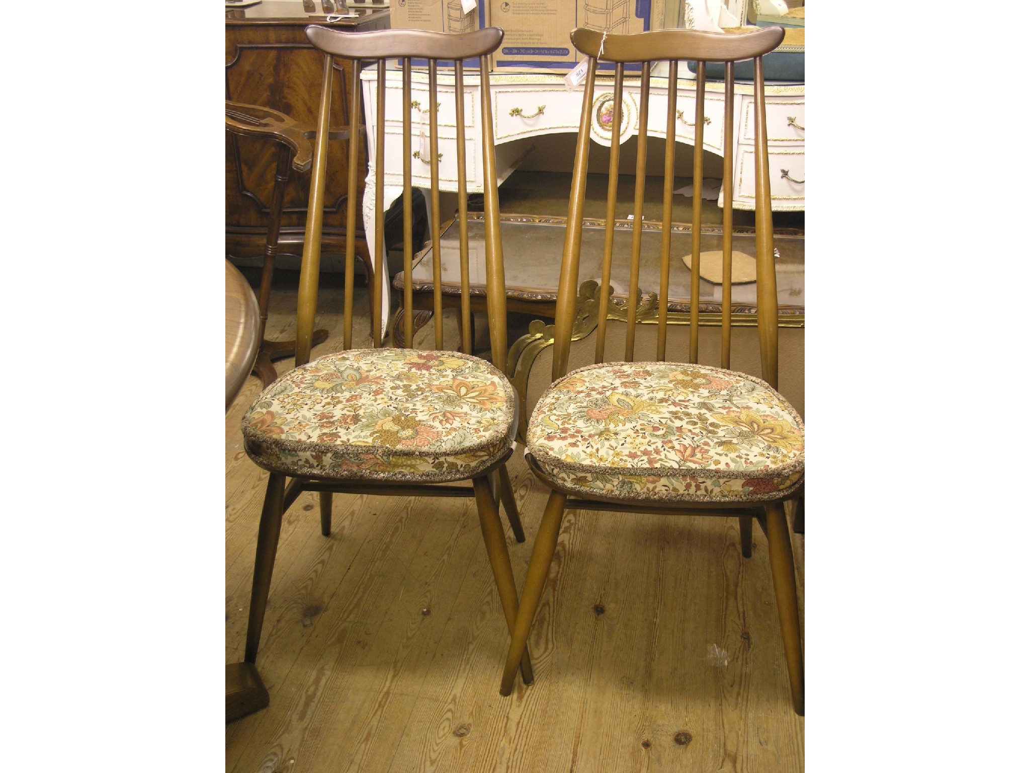 Appraisal: A set of four Ercol dining chairs Goldsmith Golden Dawn