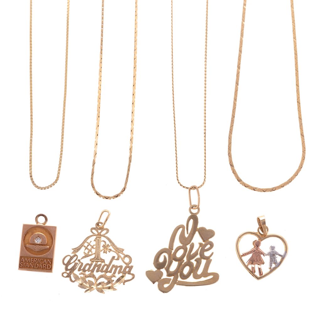 Appraisal: A Collection of Charms Chains in Gold K yellow gold