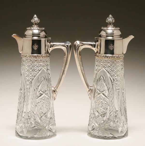 Appraisal: A pair of Austro-Hungarian silver claret jugs wheel cut glass