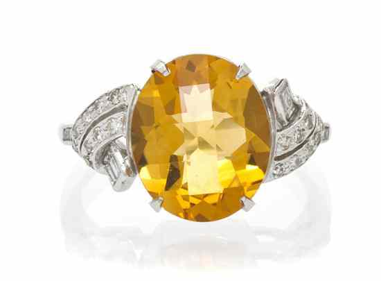 Appraisal: A Platinum Citrine and Diamond Ring containing one oval mixed