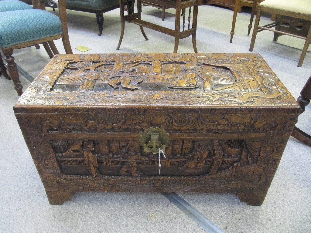 Appraisal: Chinese carved wood blanket chest decorated with Samurai figures