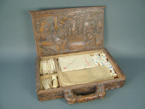 Appraisal: A th century Chinese carved wooden box decorated with figures