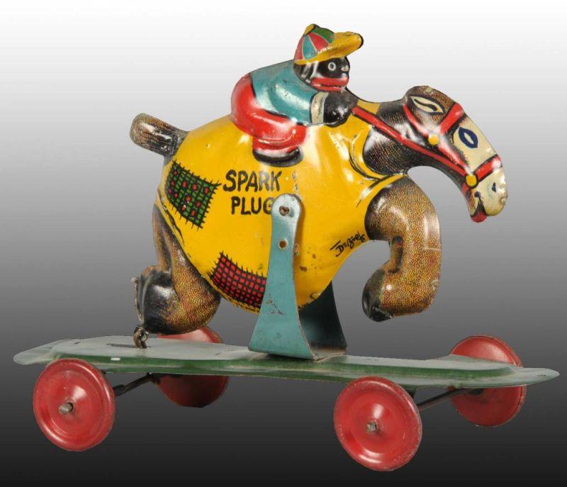 Appraisal: Tin Nifty Snowflake Riding Spark Plug Push Toy Description King