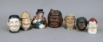 Appraisal: Seven Pottery Figural Tobacco Jars to in