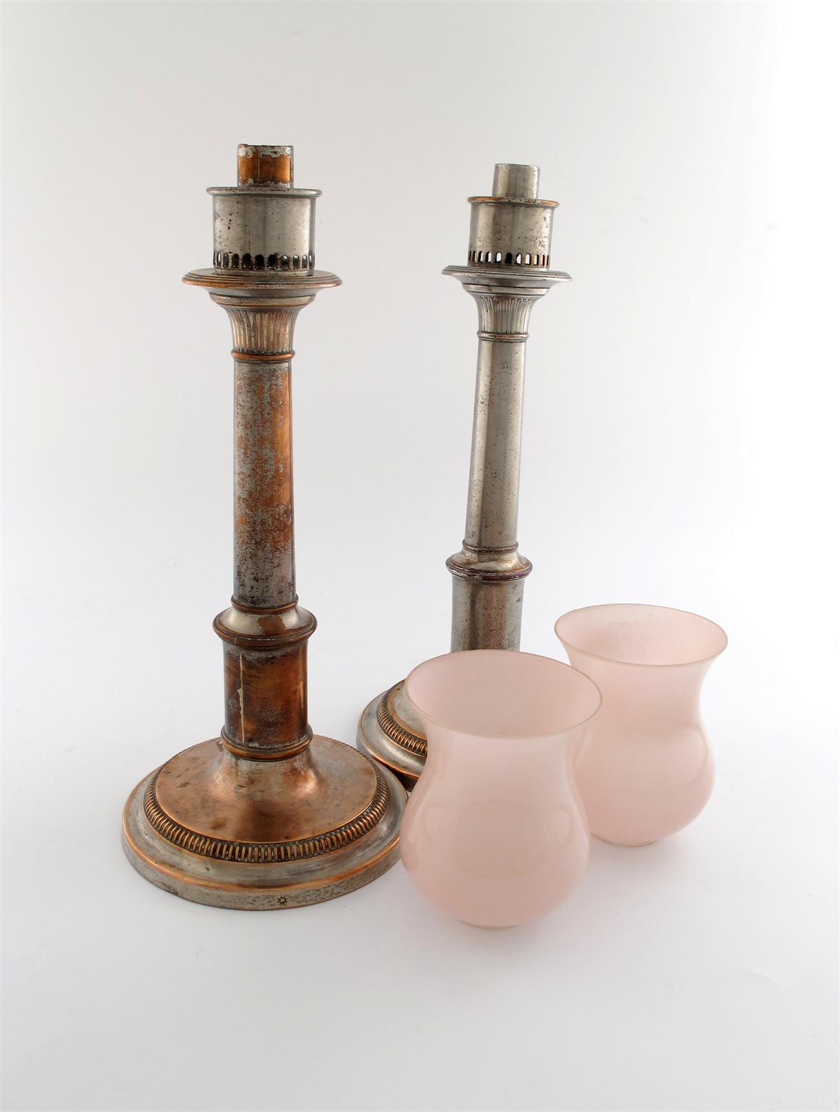 Appraisal: A pair of George III old Sheffield plated storm candlesticks