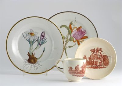 Appraisal: A creamware cup and saucer printed in red with a