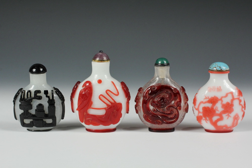 Appraisal: A GROUP OF OVERLAY GLASS SNUFF BOTTLES - Including A