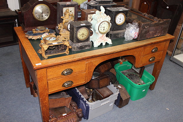 Appraisal: A GEORGE VI OAK DESK with inset top and four