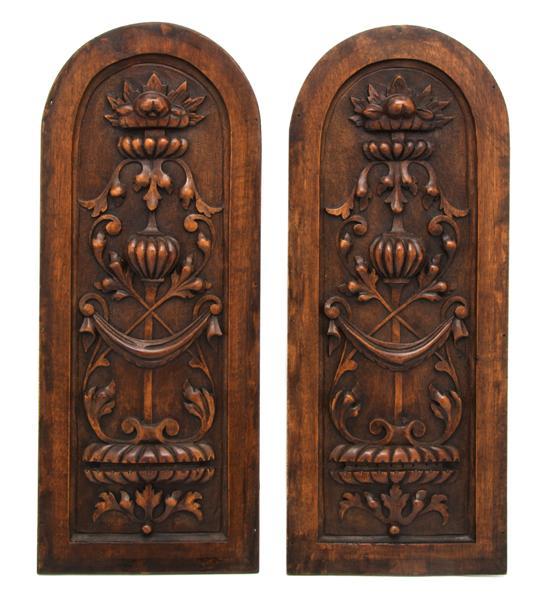 Appraisal: Pair of Carved Wood Panels of arched form each with