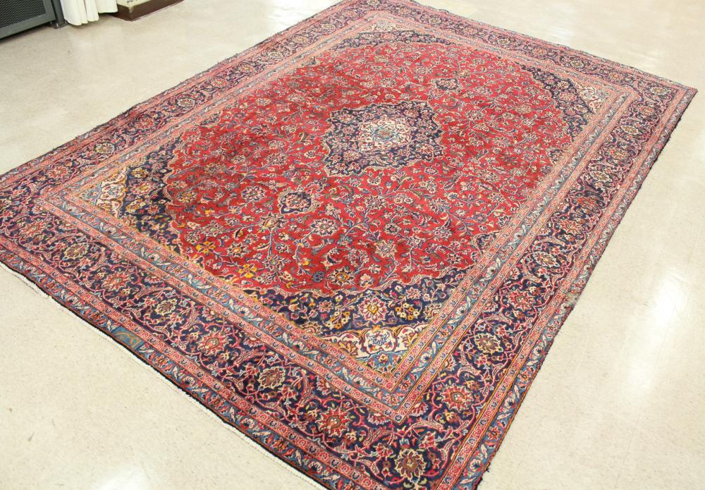 Appraisal: HAND KNOTTED PERSIAN CARPET floral and central floral medallion design