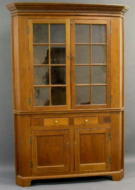 Appraisal: Pennsylvania cherry two-piece corner cupboard c h x w x