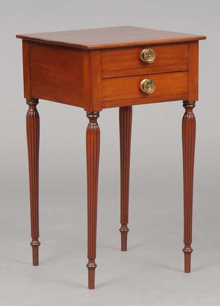 Appraisal: FEDERAL MAHOGANY TWO-DRAWER NIGHTSTAND The drawers fitted with brass repouss