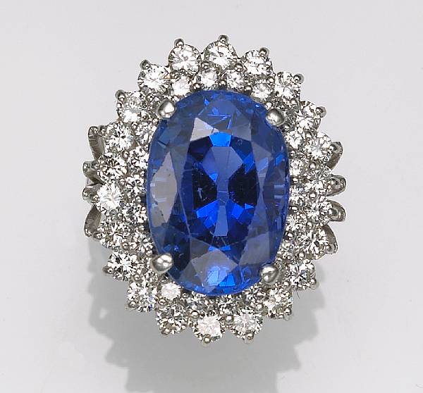 Appraisal: A diamond and synthetic sapphire ring oval-cut sapphire weighing approximately