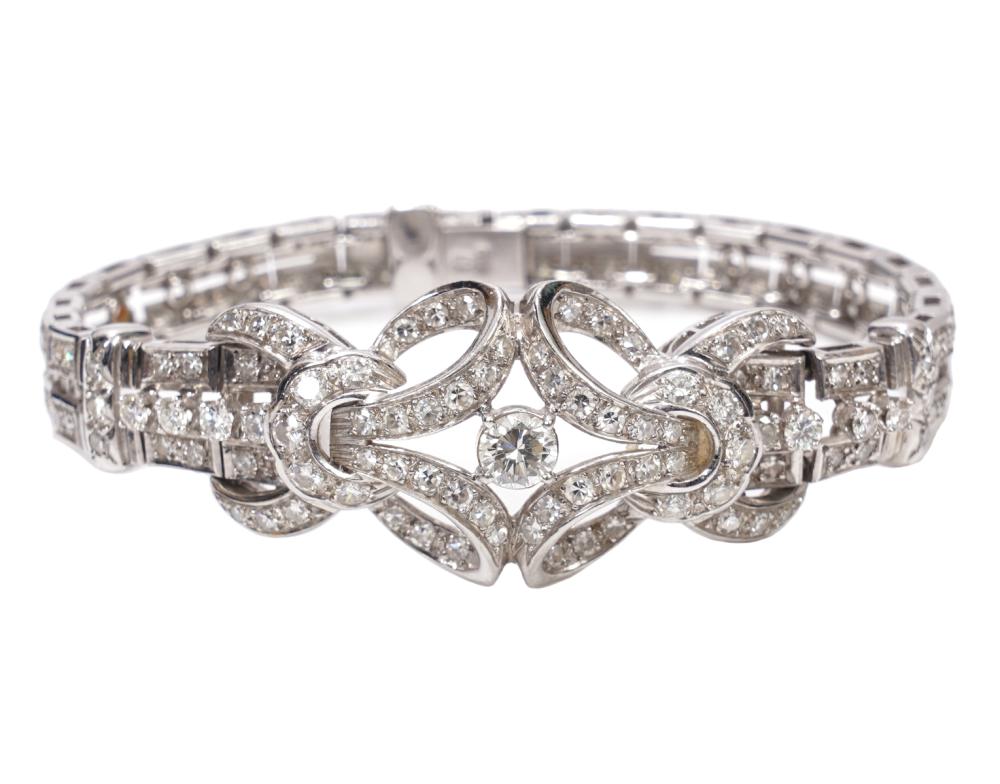 Appraisal: PLATINUM DIAMOND BRACELET CTPlatinum and diamond bracelet with domed cluster