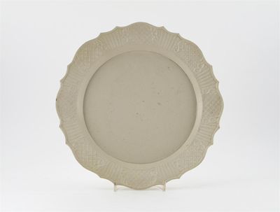 Appraisal: A large English salt-glazed dish the shaped rim moulded with