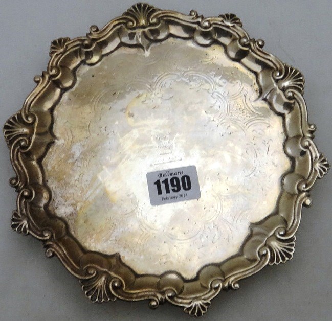 Appraisal: A Victorian silver salver of shaped circular form with engraved