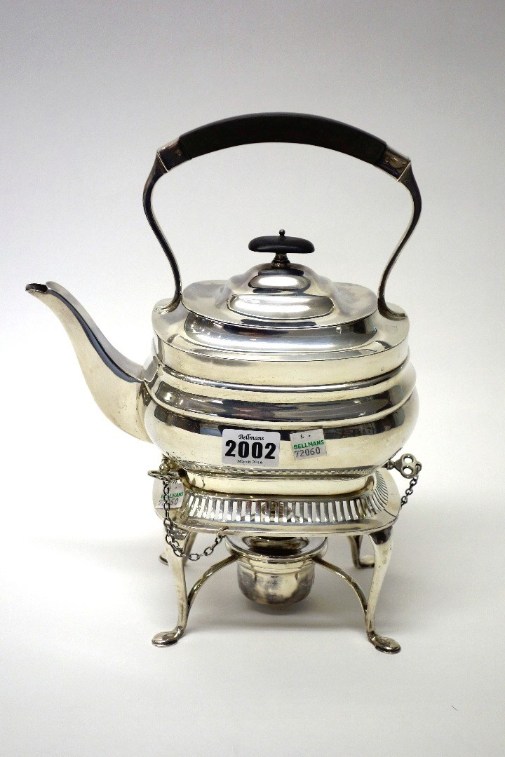 Appraisal: A silver tea kettle stand and associated spirit burner of