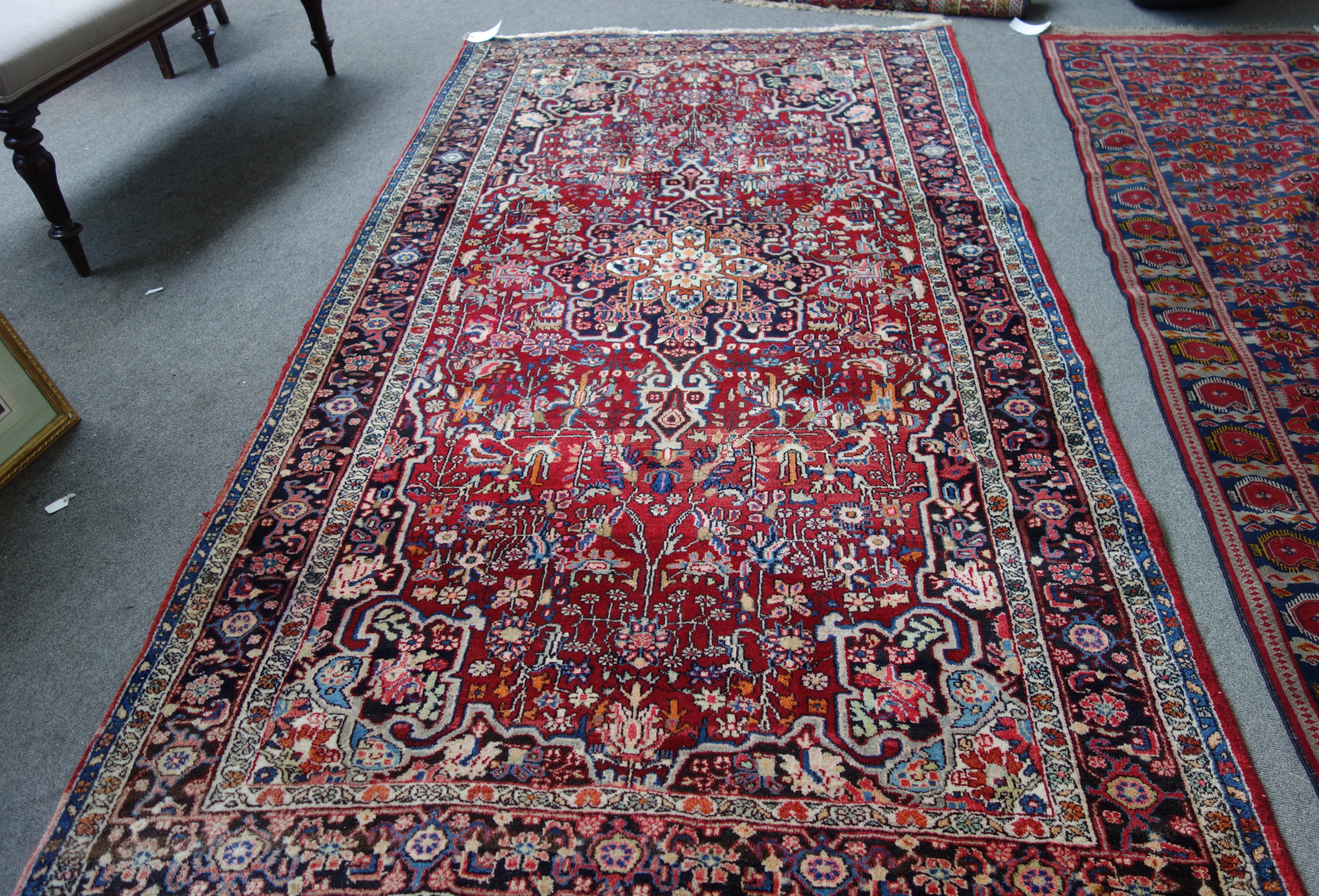 Appraisal: A Bidjar rug Persian the madder field with a black