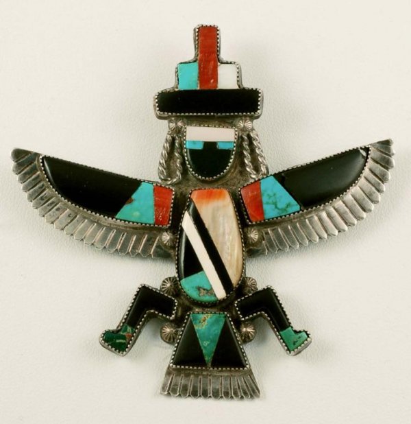 Appraisal: A sterling silver pin of a dancing Zuni Kachina figure