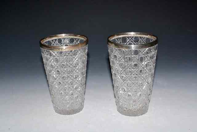 Appraisal: A PAIR OF SILVER MOUNTED CUT GLASS VASES of tapering