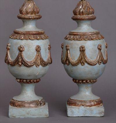 Appraisal: PAIR OF ITALIAN NEOCLASSICAL-STYLE CARVED PAINTED AND SILVERED WOOD URNS