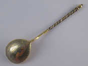 Appraisal: A Russian silver gilt teaspoon the bowl bright cut engraved