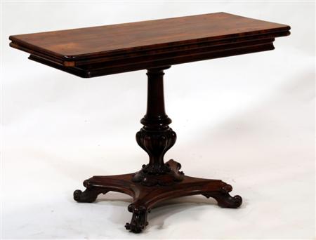 Appraisal: An early Victorian rosewood foldover table of rounded rectangular form