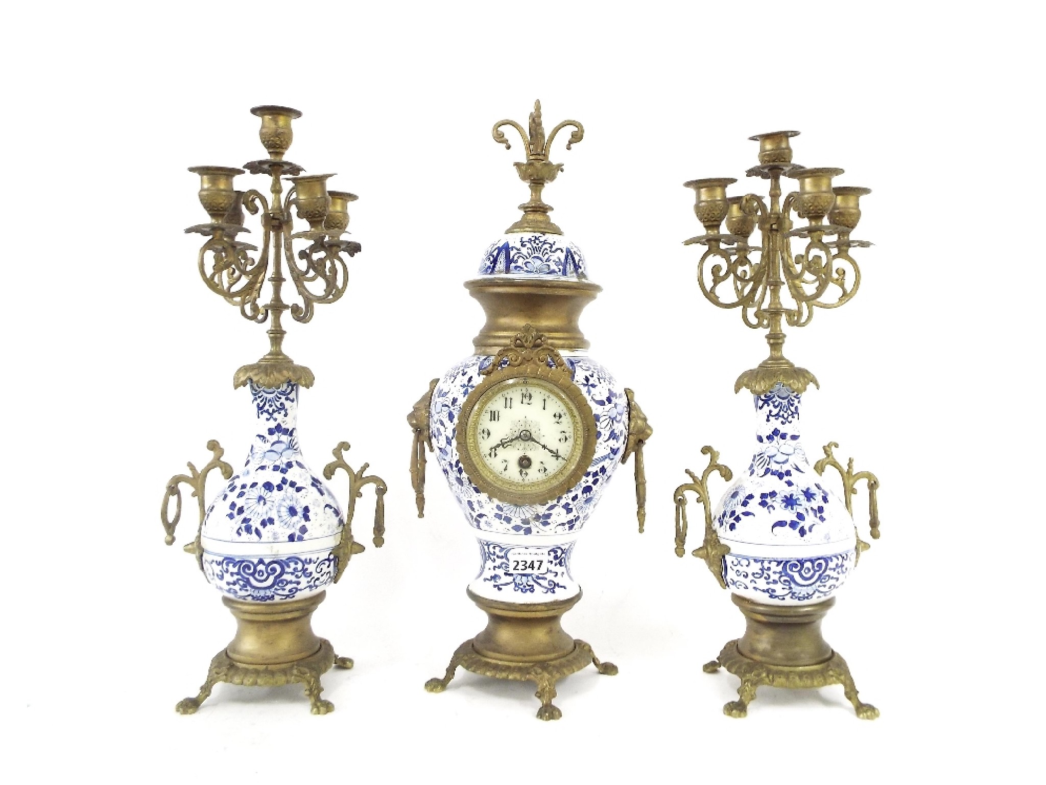 Appraisal: Delft type pottery and gilt metal single train mantel clock