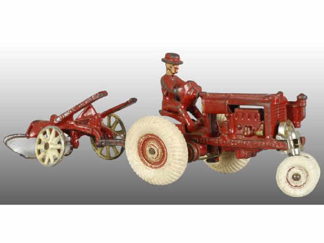 Appraisal: Cast Iron Toy Arcade McCormick-Deering Tractor Description Red tractor with