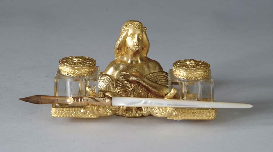 Appraisal: ART NOUVEAU INKWELL SET Metal holder of a lady with