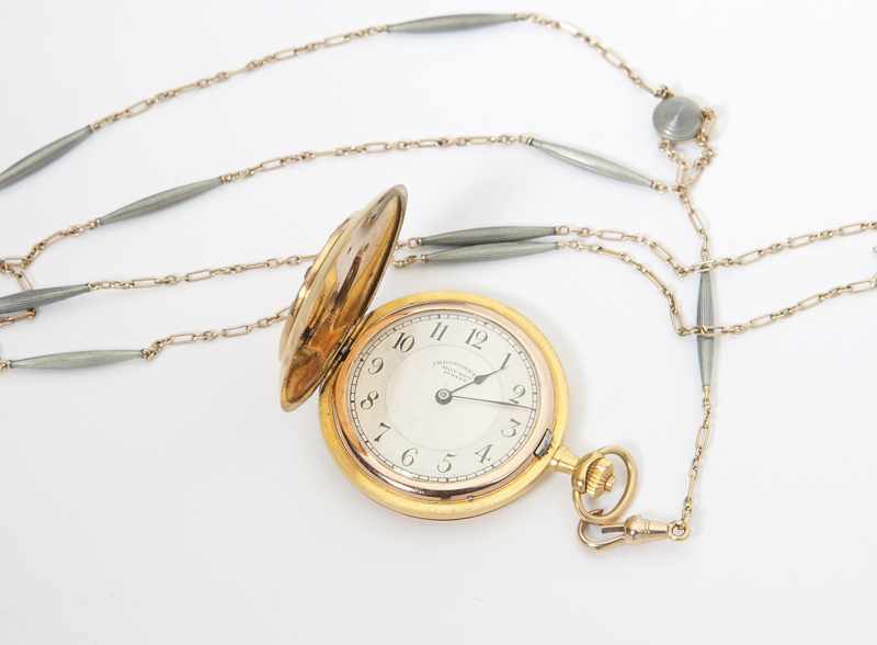 Appraisal: A lady's hunter case pocket watch and fob The dial