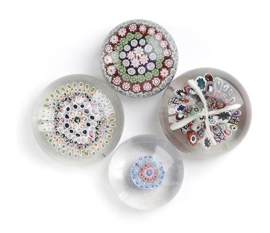 Appraisal: Four French paperweights mid th century Variously set with coloured