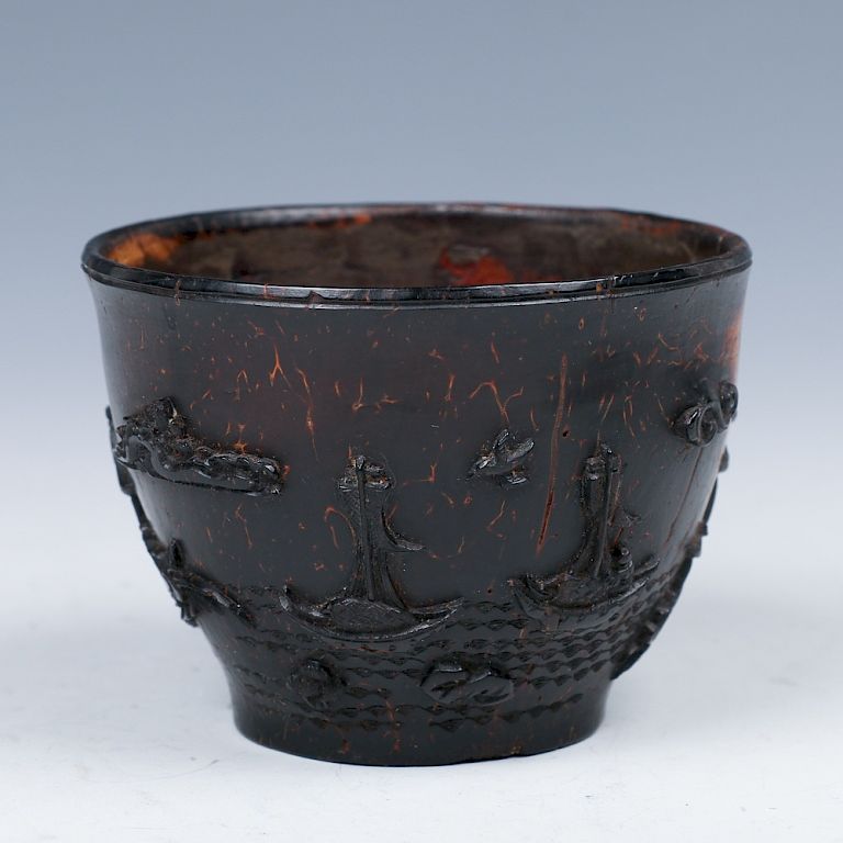 Appraisal: CARVED COCONUT WHINE CUP LATE MING Of globular body to