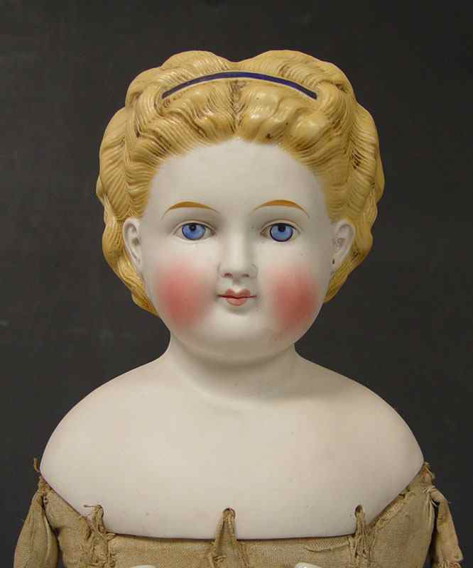 Appraisal: BISQUE SHOULDER HEAD DOLL Unmarked as to maker Bisque head