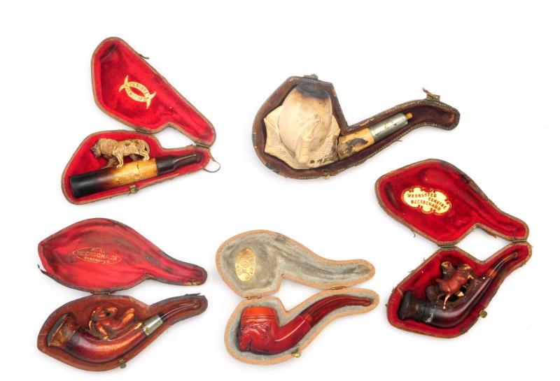 Appraisal: Collection Of Meerschaum Pipes Consisting of cased horse lion cherub