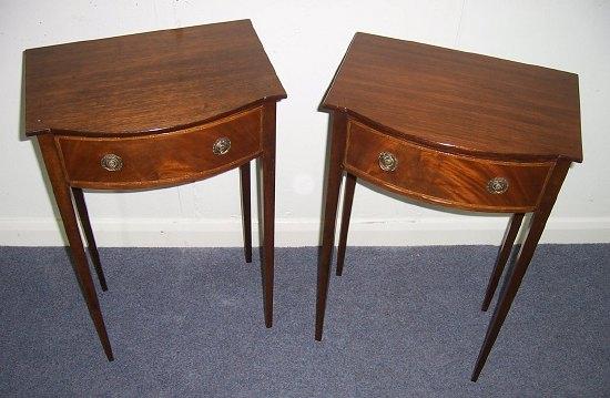 Appraisal: A pair of bedside tables each with shaped top above